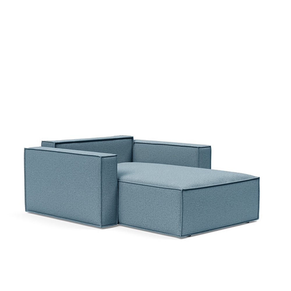 The Newilla Lounger Chair with Standard Arms from Innovation Living with mixed dance light blue 525 upholstery setup as a bed with the cushion removed.