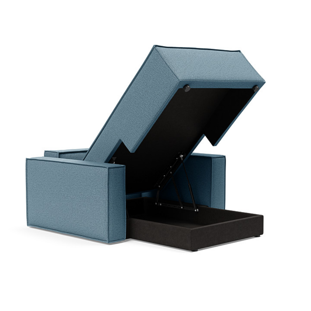 The Newilla Lounger Chair with Standard Arms from Innovation Living with mixed dance light blue 525 upholstery showing off the internal storage space.