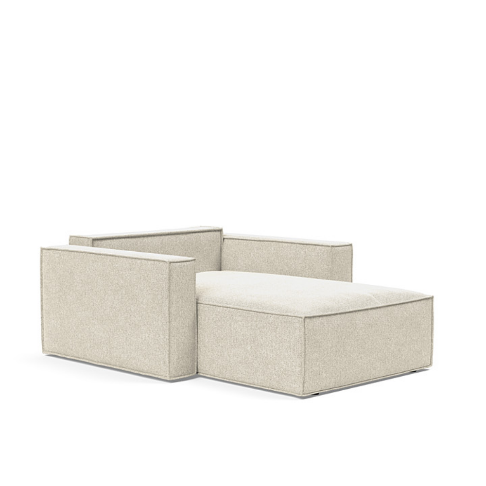 The Newilla Lounger Chair with Standard Arms from Innovation Living with taura off white 357 upholstery setup as a bed with the cushion removed.