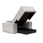 The Newilla Lounger Chair with Wide Arms from Innovation Living with adario fog 256 upholstery open showing the internal storage.