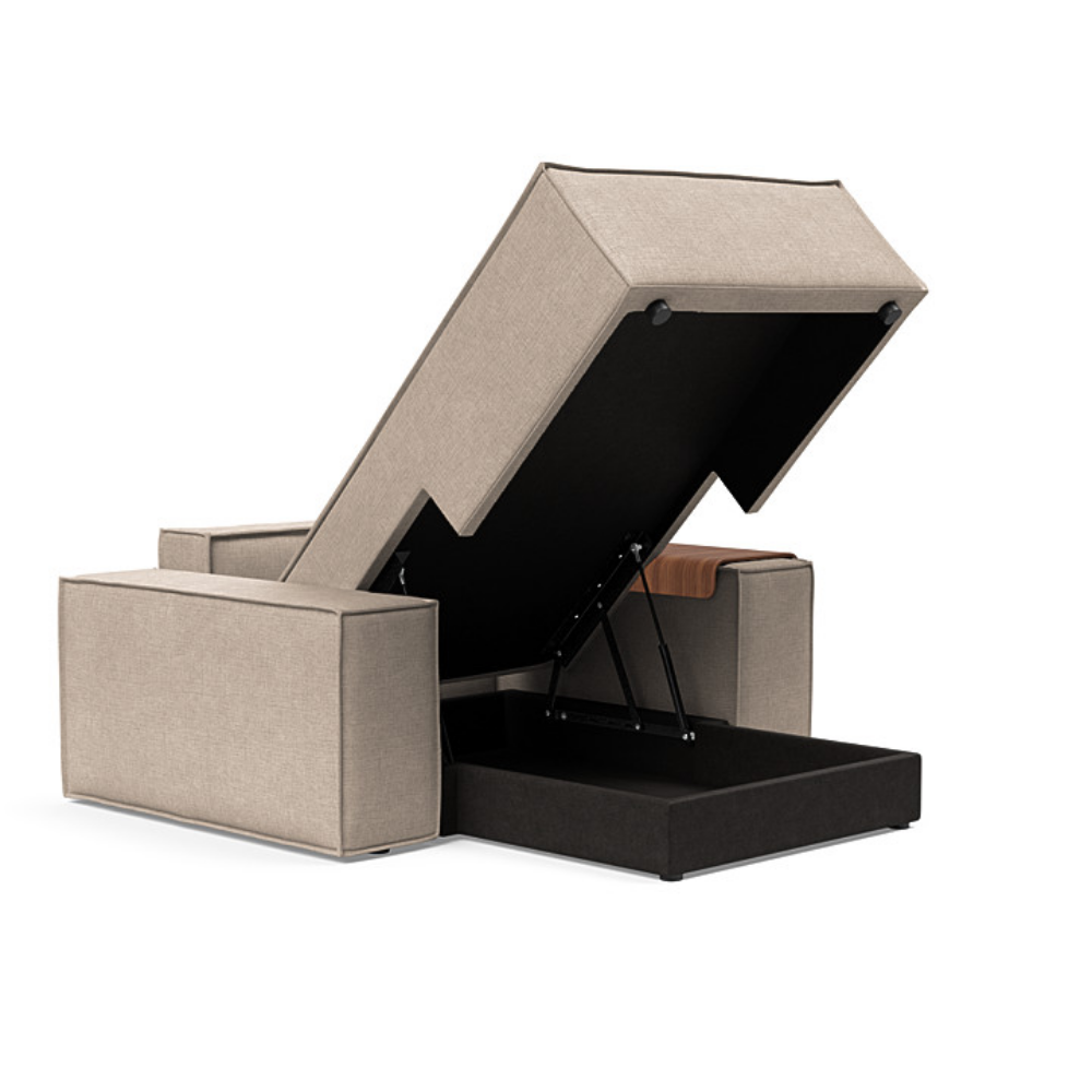 The Newilla Lounger Chair with Wide Arms from Innovation Living with adario taupe 257 upholstery open showing the internal storage.