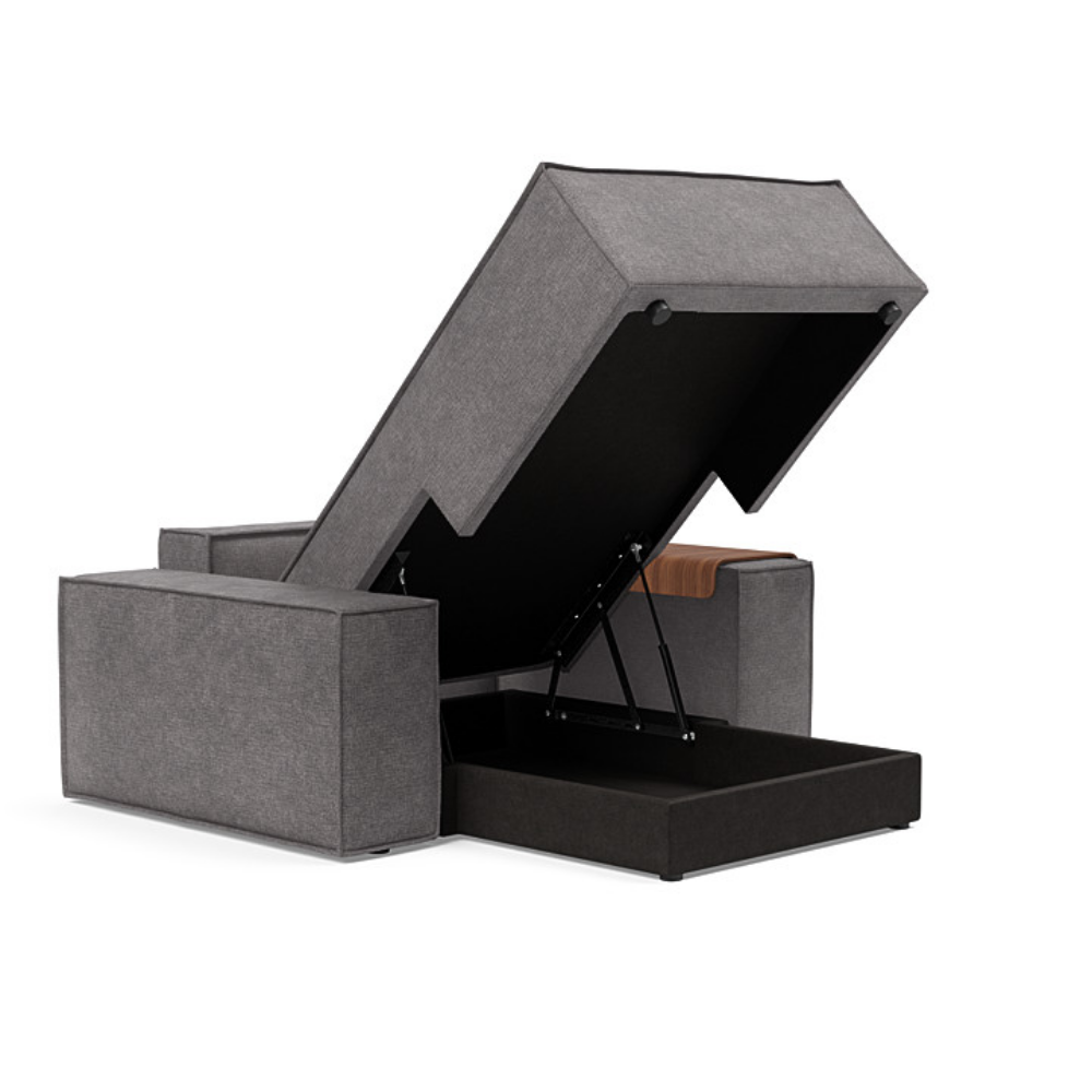 The Newilla Lounger Chair with Wide Arms from Innovation Living with avella warm grey 282 upholstery open and showing the internal storage.