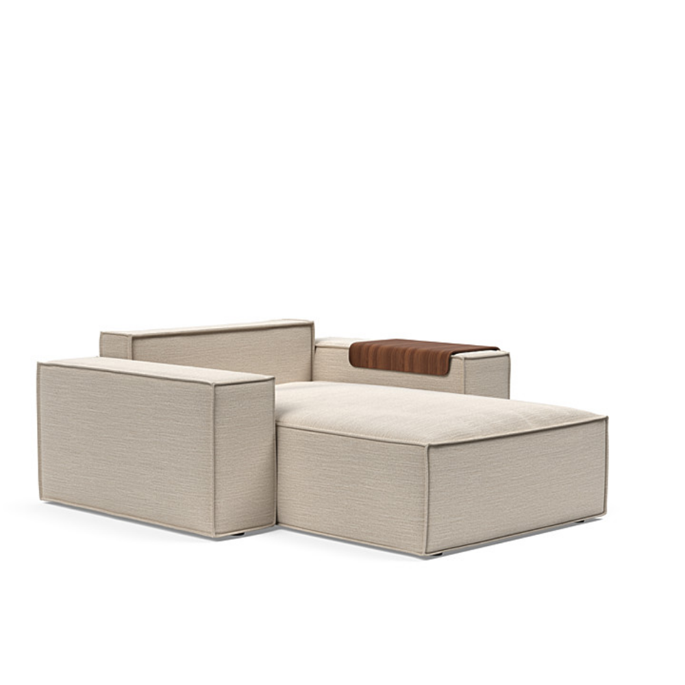 The Newilla Lounger Chair with Wide Arms from Innovation Living with blida sand grey 612 upholstery without the cushion, setup as a bed.