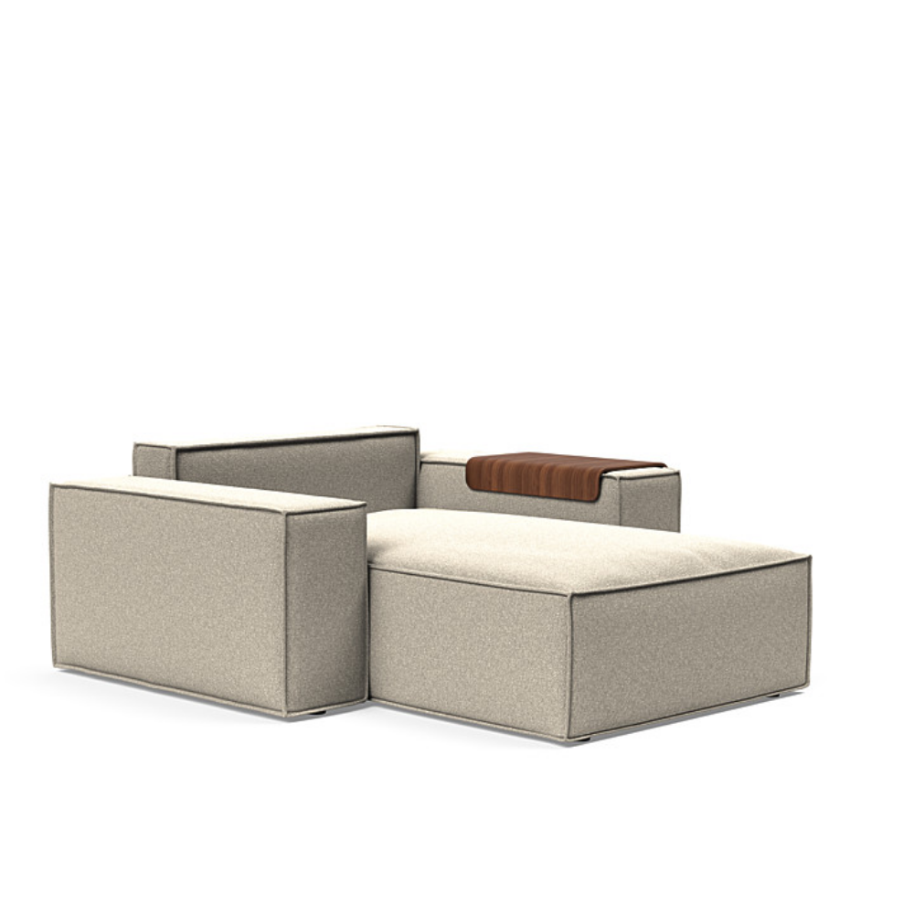 The Newilla Lounger Chair with Wide Arms from Innovation Living with boucle beige 539 upholstery without the cushion, setup as a bed.