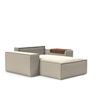 The Newilla Lounger Chair with Wide Arms from Innovation Living with boucle beige 539 upholstery without the cushion, setup as a bed.