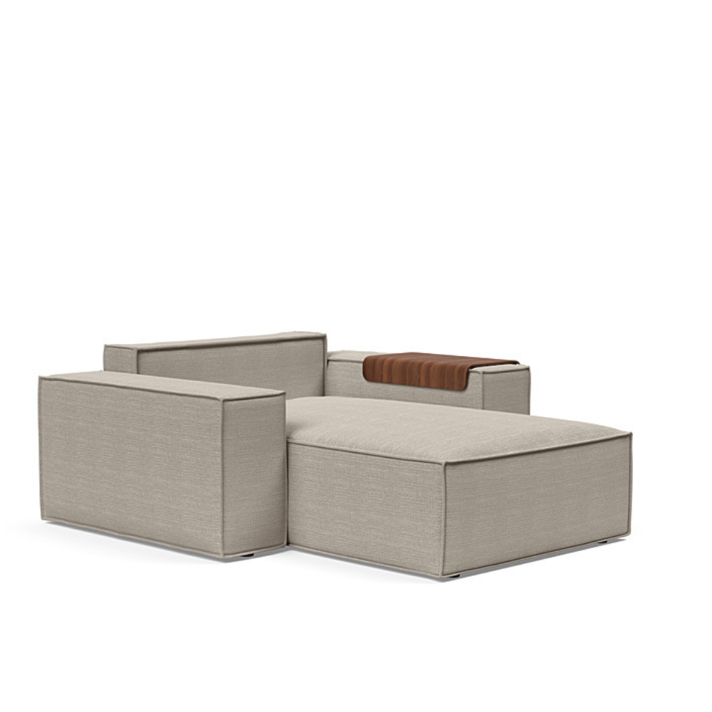 The Newilla Lounger Chair with Wide Arms from Innovation Living with kenya gravel 579 upholstery without the cushion, setup as a bed.