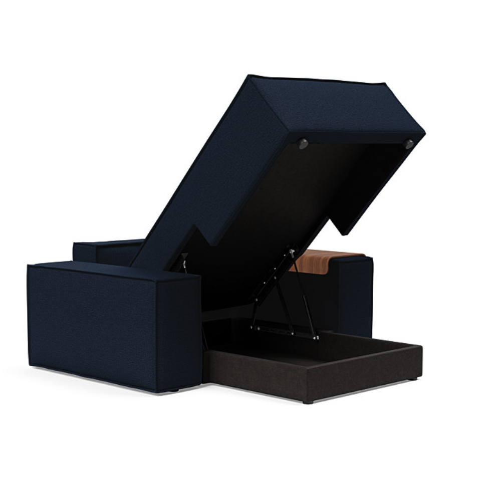 The Newilla Lounger Chair with Wide Arms from Innovation Living with mixed dance blue 528 upholstery open showing the internal storage.