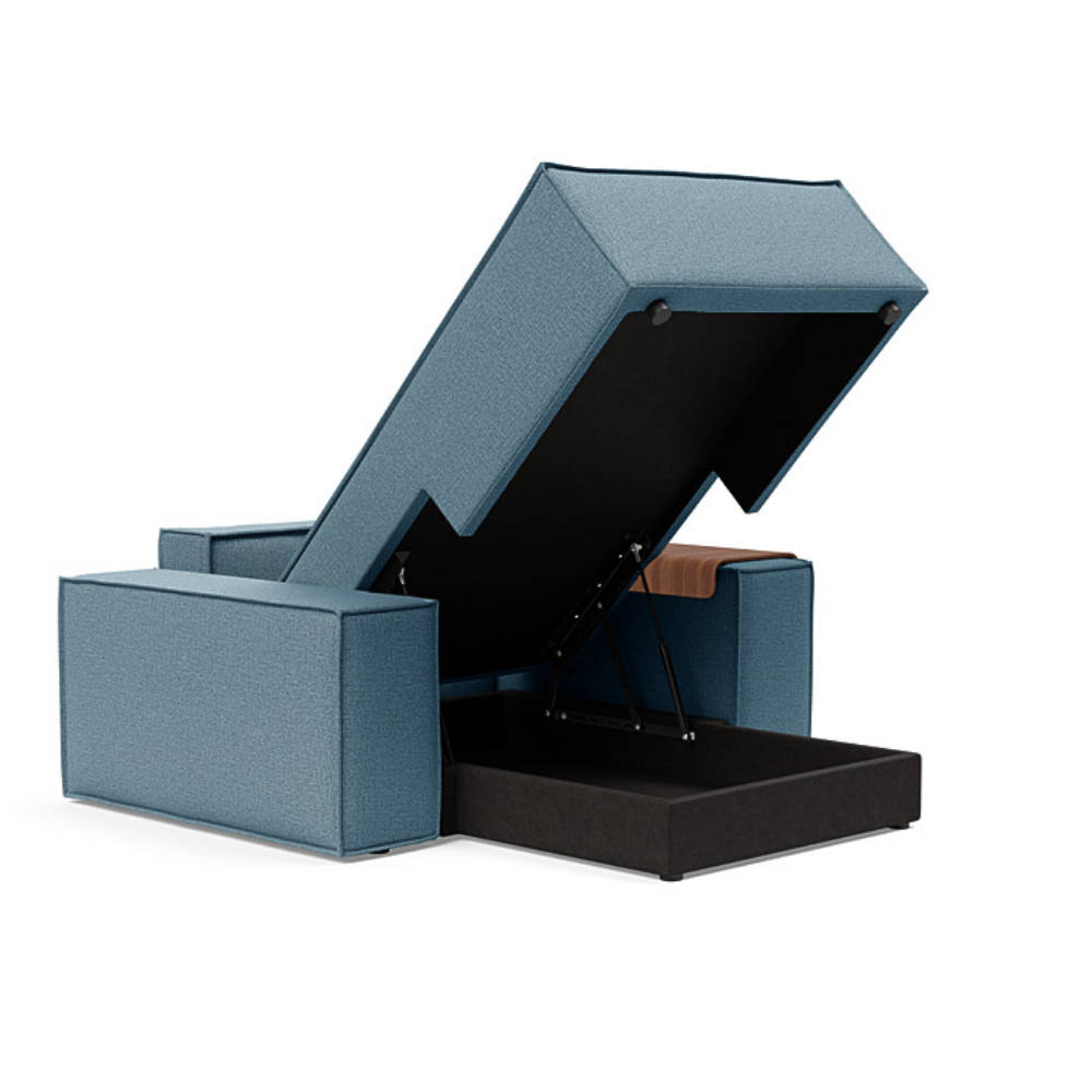 The Newilla Lounger Chair with Wide Arms from Innovation Living with mixed dance light blue 525 upholstery open and showing the internal storage.