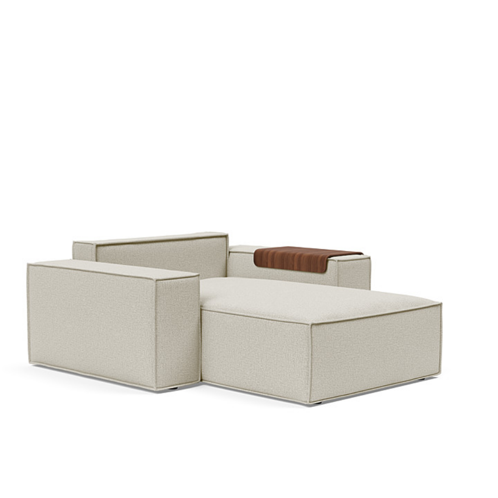 The Newilla Lounger Chair with Wide Arms from Innovation Living with mixed dance natural 527 upholstery without the cushion, setup as a bed.