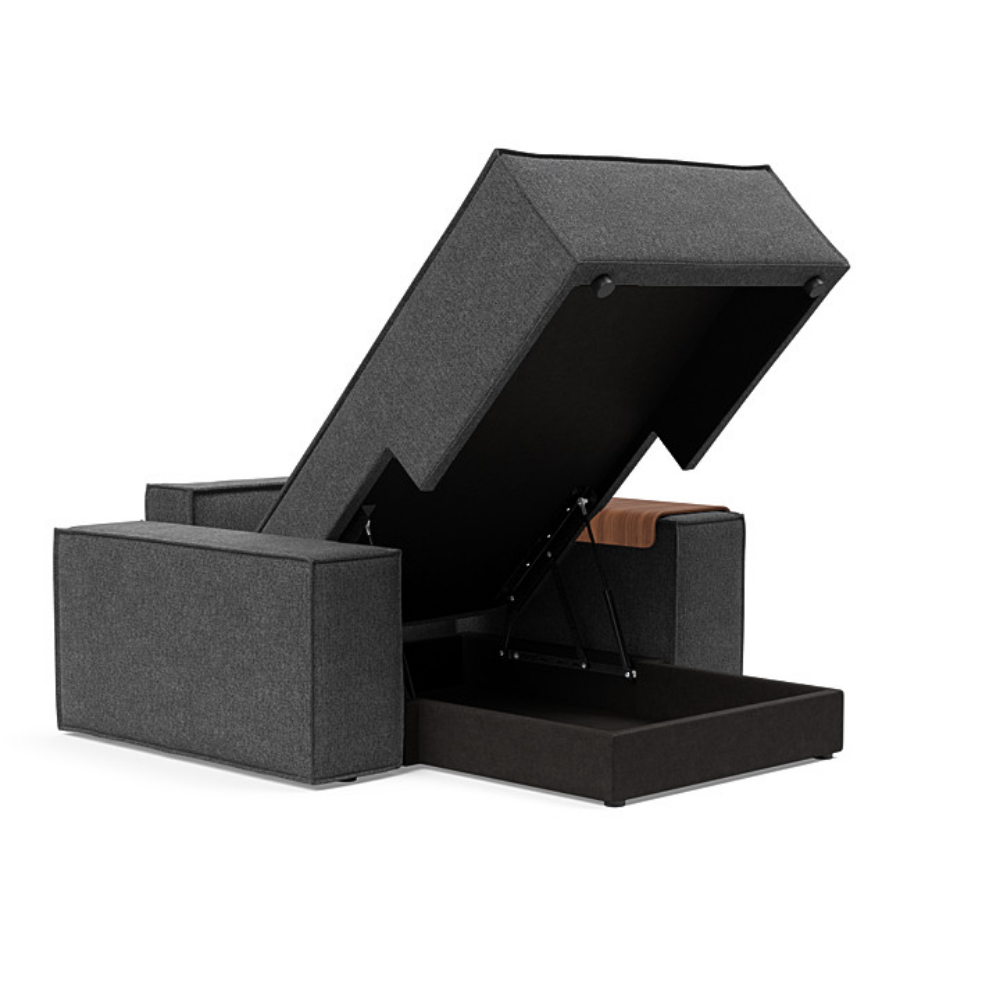 The Newilla Lounger Chair with Wide Arms from Innovation Living with taura deep grey 350 upholstery open showing the internal storage.