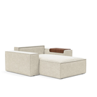 The Newilla Lounger Chair with Wide Arms from Innovation Living with taura off white 357 upholstery without the cushion, setup as a bed.