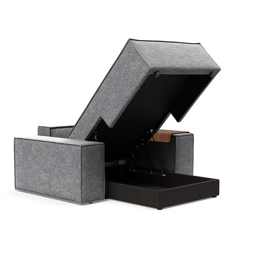 The Newilla Lounger Chair with Wide Arms from Innovation Living with taura slate grey 351 upholstery open showing the internal storage.