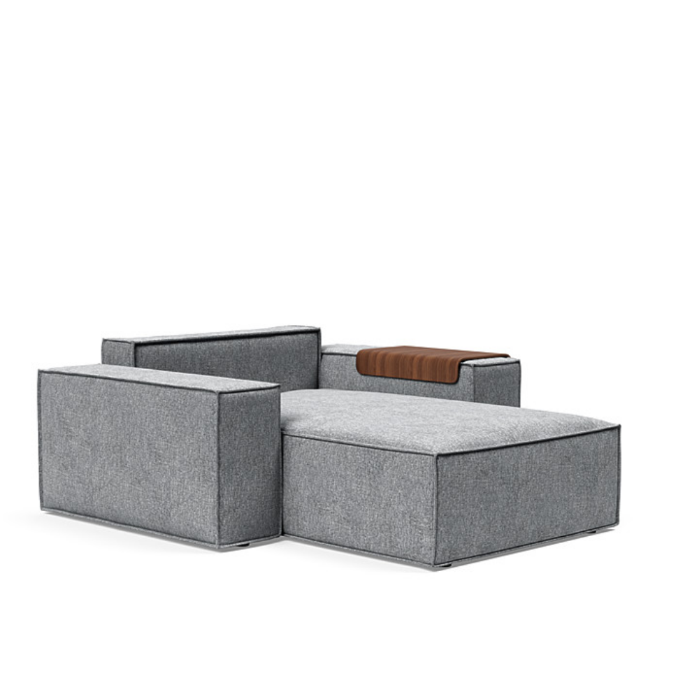 The Newilla Lounger Chair with Wide Arms from Innovation Living with twist granite 565 upholstery without the cushion, setup as a bed.