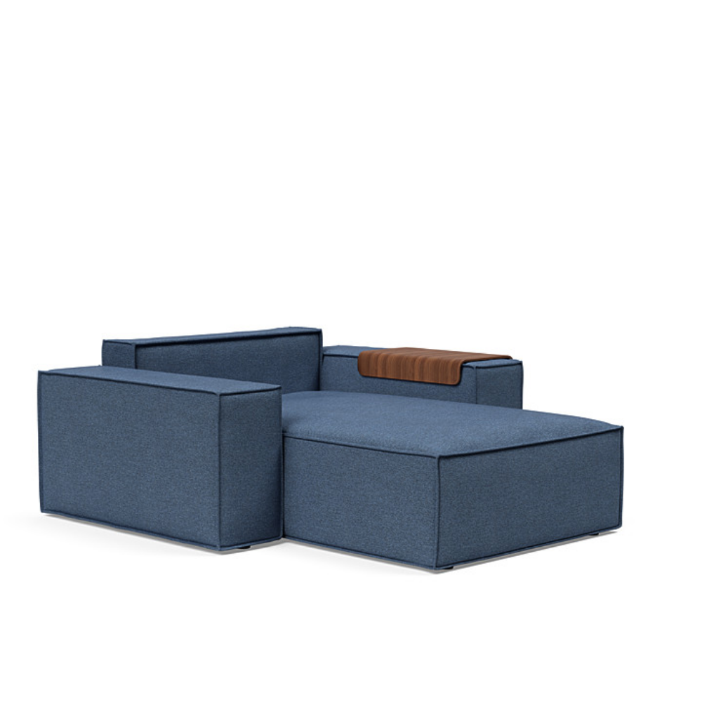 The Newilla Lounger Chair with Wide Arms from Innovation Living with weda blue 302 upholstery without the cushion, setup as a bed.