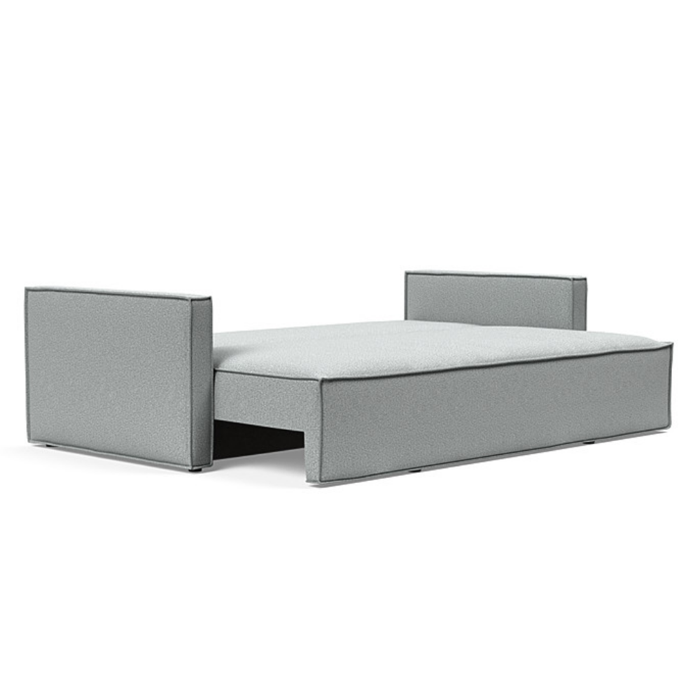 The Newilla Sleeper Sofa from Innovation Living with slim arms and melange light grey 538 upholstery setup as a bed.