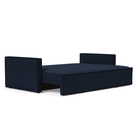 The Newilla Sleeper Sofa from Innovation Living with slim arms and mixed dance blue 528 upholstery setup as a bed.