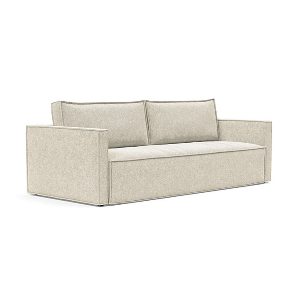 The Newilla Sleeper Sofa from Innovation Living with slim arms and taura off white 357 upholstery setup as a sofa.