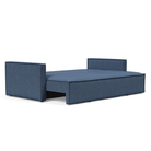 The Newilla Sleeper Sofa from Innovation Living with slim arms and weda blue 302 upholstery setup as a bed.