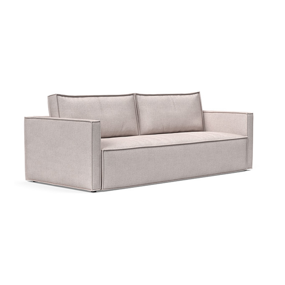 The Newilla Sleeper Sofa from Innovation Living with slim arms and weda sand 300 upholstery setup as a sofa.