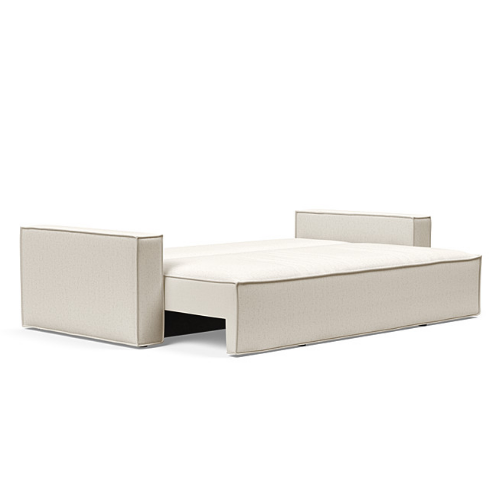 The Newilla Sleeper Sofa from Innovation Living with standard arms and boucle off white 531 upholstery setup as a bed.