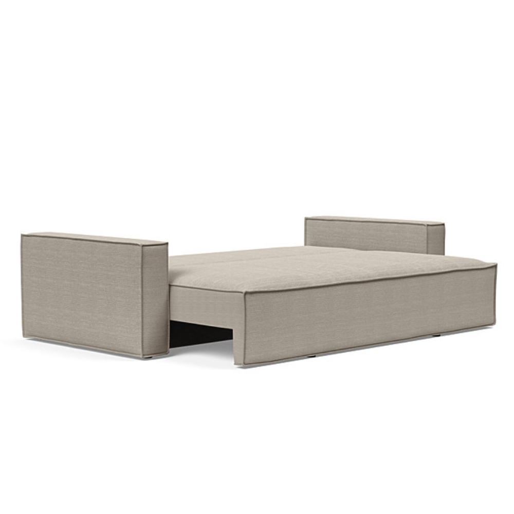 The Newilla Sleeper Sofa from Innovation Living with standard arms and kenya gravel 579 upholstery setup as a bed.