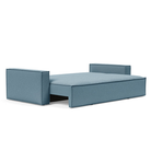 The Newilla Sleeper Sofa from Innovation Living with standard arms and mixed dance light blue 525 upholstery setup as a bed.