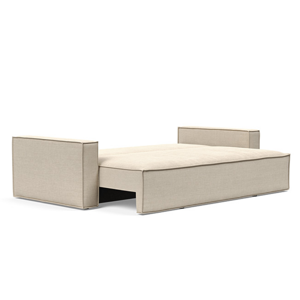 The Newilla Sleeper Sofa from Innovation Living with standard arms and phobos latte 586 upholstery setup as a bed.