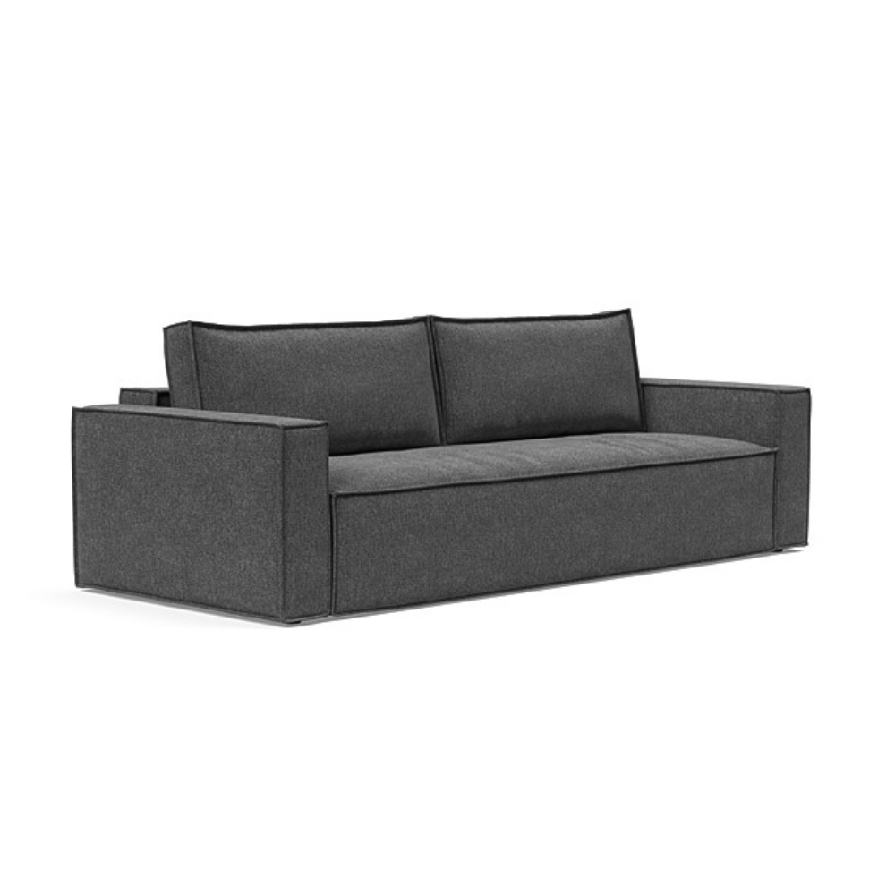 The Newilla Sleeper Sofa from Innovation Living with standard arms and taura deep grey 350 upholstery setup as a sofa.