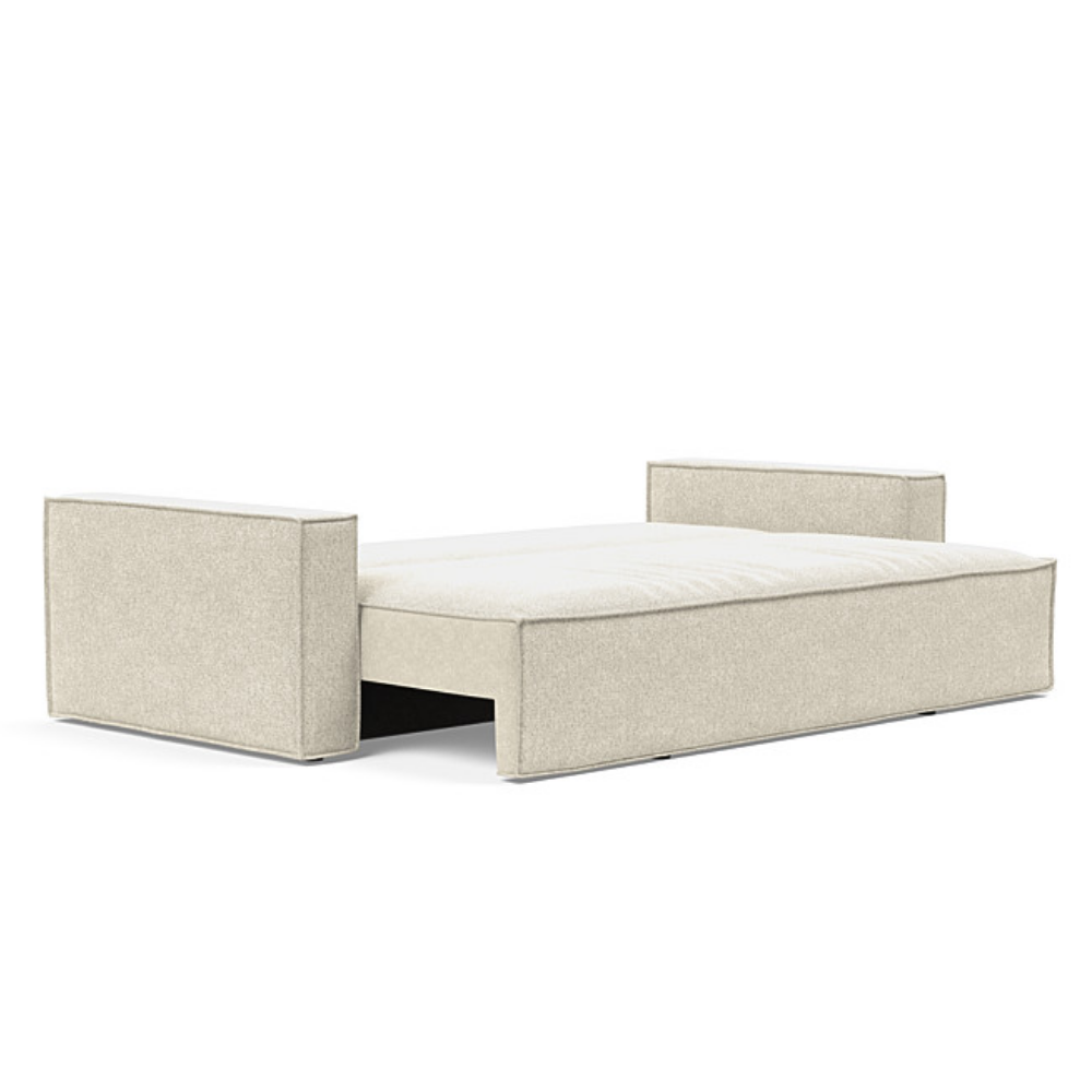 The Newilla Sleeper Sofa from Innovation Living with standard arms and taura off white 357 upholstery setup as a bed.