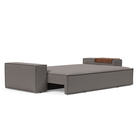 The Newilla Sleeper Sofa from Innovation Living with wide arms and mixed dance grey 521 upholstery setup as a bed.