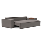 The Newilla Sleeper Sofa from Innovation Living with wide arms and mixed dance grey 521 upholstery seat pulled out of the couch.