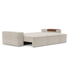 The Newilla Sleeper Sofa from Innovation Living with wide arms and avella sand 280 upholstery setup as a bed.