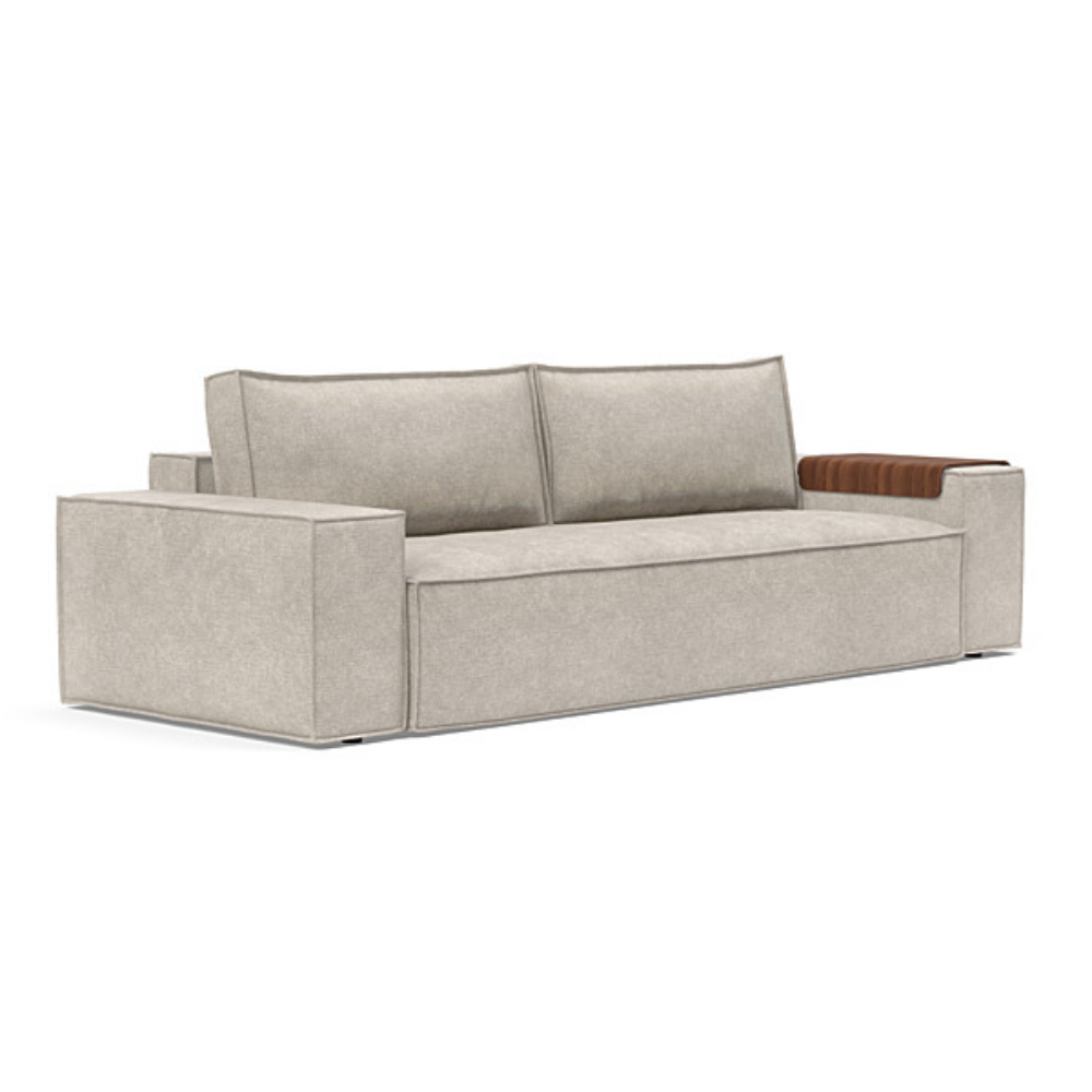 The Newilla Sleeper Sofa from Innovation Living with wide arms and avella sand 280 upholstery setup as a sofa.