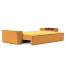 The Newilla Sleeper Sofa from Innovation Living with wide arms and boucle ochre 536 upholstery setup as a bed.