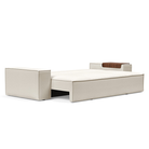 The Newilla Sleeper Sofa from Innovation Living with wide arms and boucle off white 531 upholstery setup as a bed.