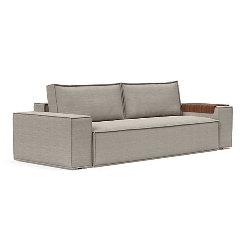 The Newilla Sleeper Sofa from Innovation Living with wide arms and kenya gravel 579 upholstery setup as a sofa.