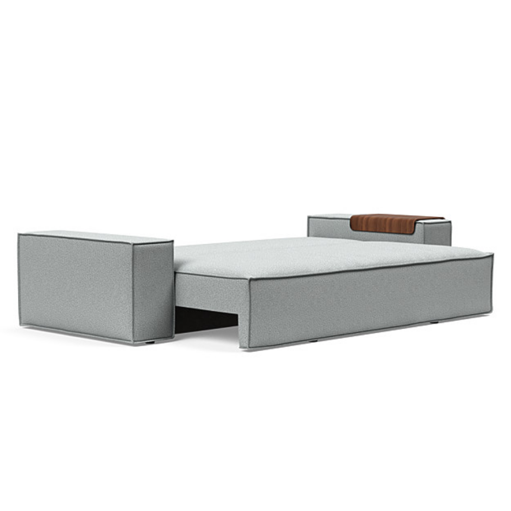 The Newilla Sleeper Sofa from Innovation Living with wide arms and melange light grey 538 upholstery setup as a bed.