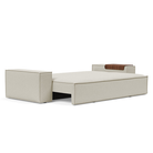 The Newilla Sleeper Sofa from Innovation Living with wide arms and mixed dance natural 527 upholstery setup as a bed.