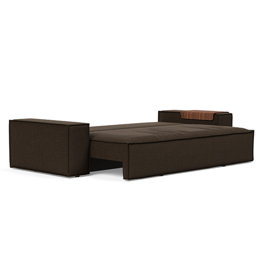 The Newilla Sleeper Sofa from Innovation Living with wide arms and taura chocco 358 upholstery setup as a bed.