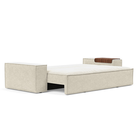 The Newilla Sleeper Sofa from Innovation Living with wide arms and taura off white 357 upholstery setup as a bed.