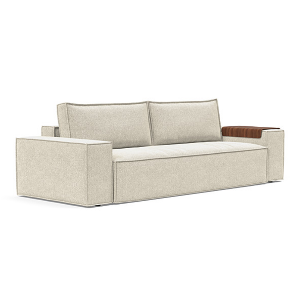 The Newilla Sleeper Sofa from Innovation Living with wide arms and taura off white 357 upholstery setup as a sofa.