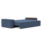 The Newilla Sleeper Sofa from Innovation Living with wide arms and weda blue 302 upholstery setup as a bed.
