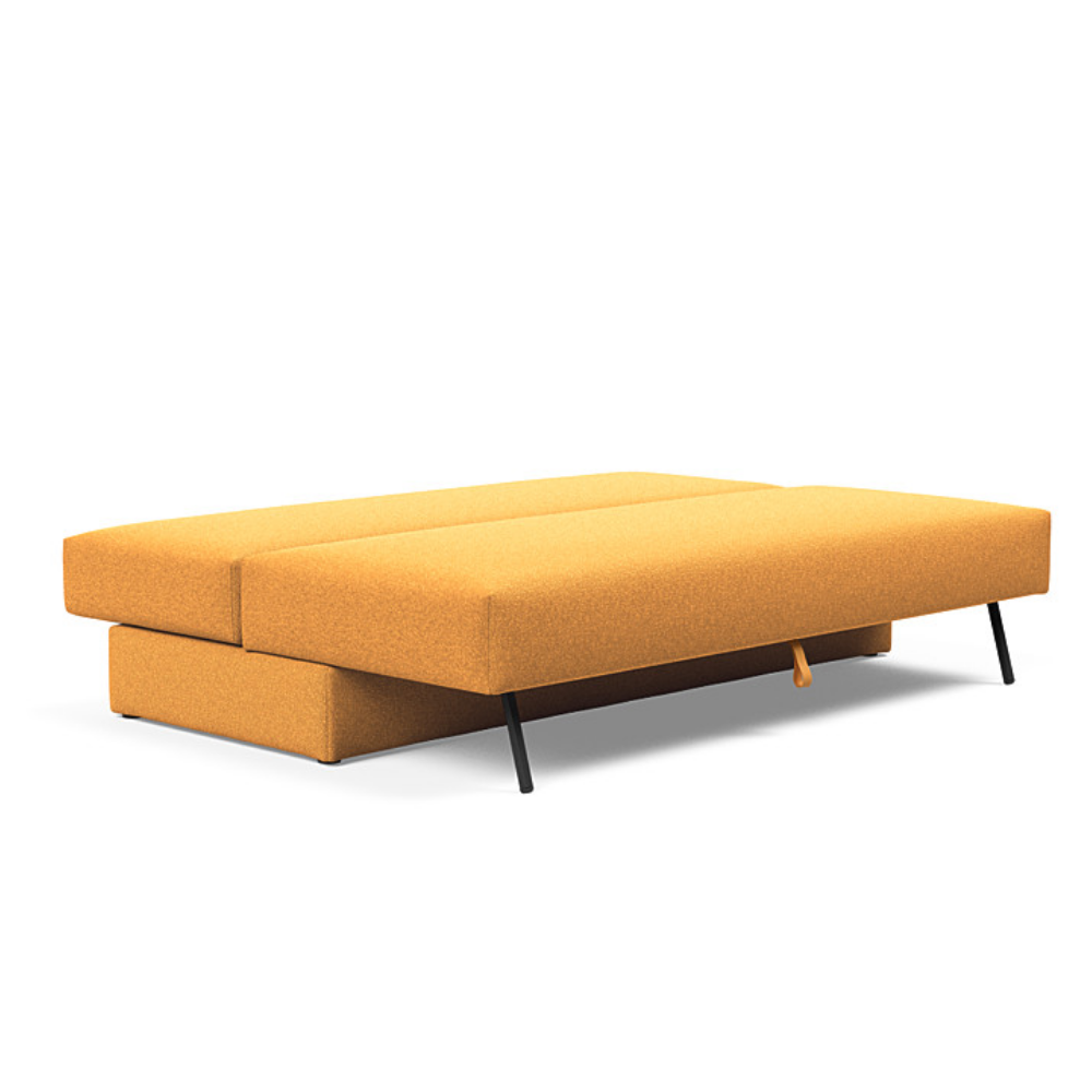The Osvald Sofa Bed from Innovation Living with boucle ochre 536 upholstery setup as a bed.
