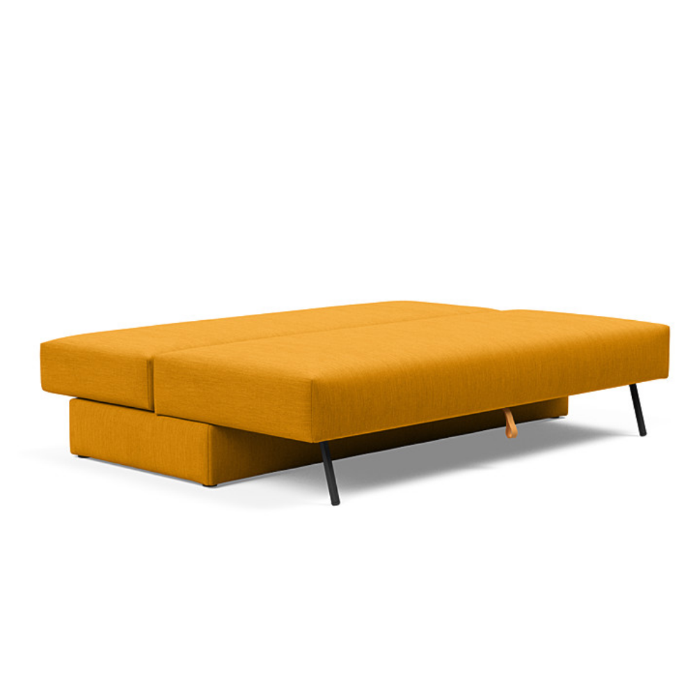 The Osvald Sofa Bed from Innovation Living with elegance burned curry 507 upholstery setup as a bed.