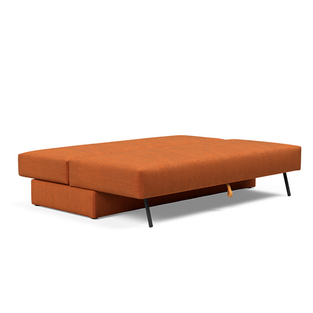 The Osvald Sofa Bed from Innovation Living with esina rust orange 412 upholstery setup as a bed.