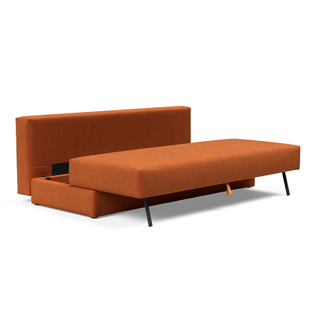 The Osvald Sofa Bed from Innovation Living with esina rust orange 412 upholstery showing the internal storage unit.