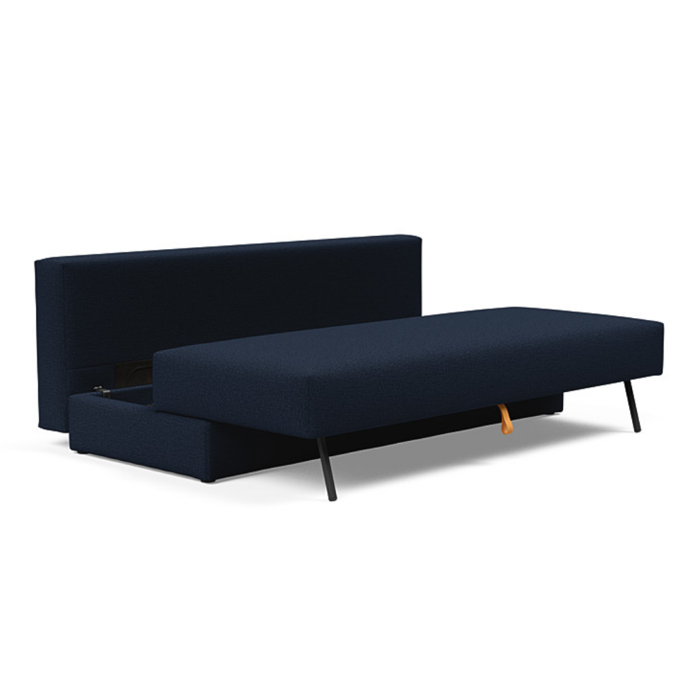 The Osvald Sofa Bed from Innovation Living with mixed dance blue 528 upholstery showcasing the storage spaec of the unit.