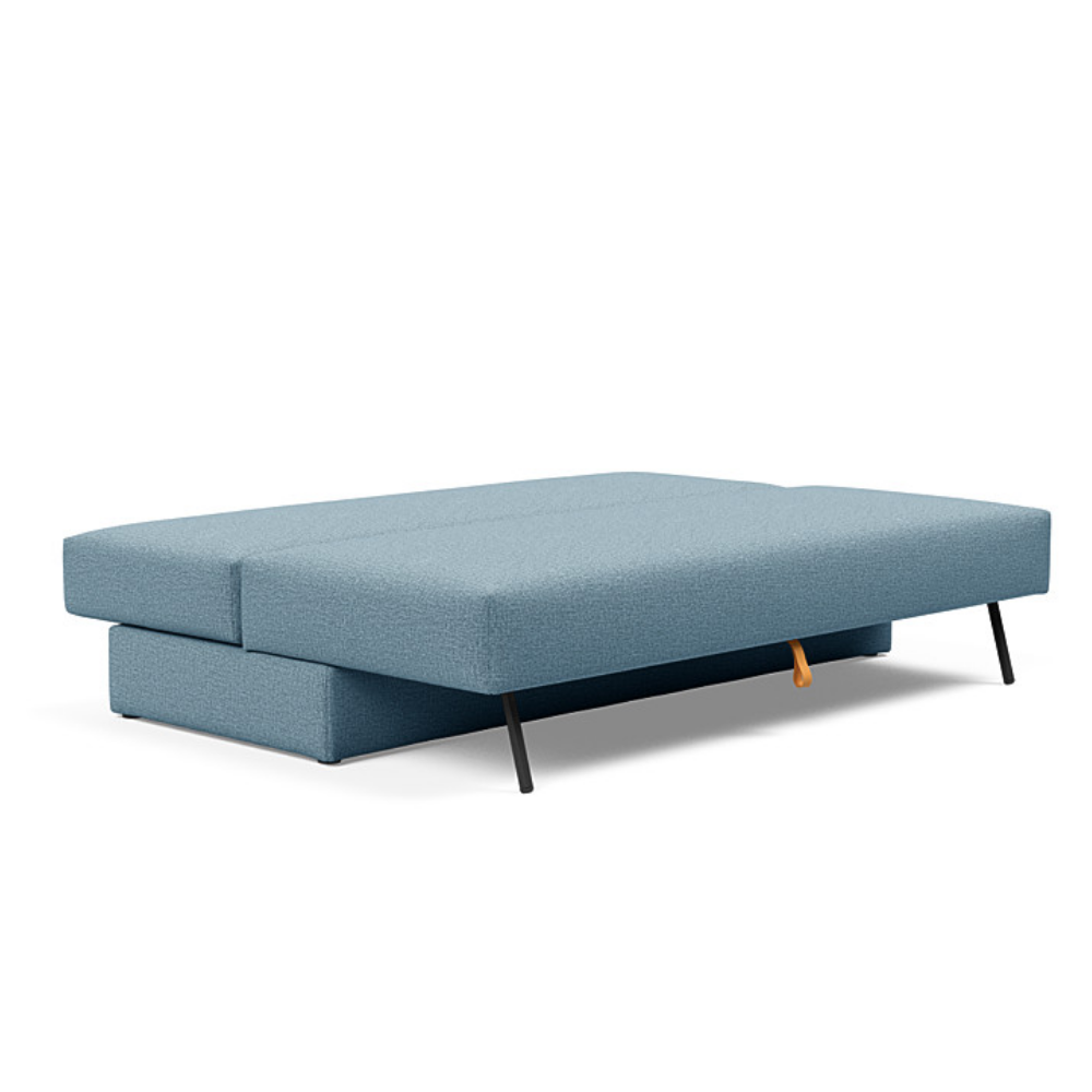 The Osvald Sofa Bed from Innovation Living with mixed dance light blue 525 upholstery setup as a bed.