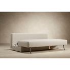 The Osvald Sofa Bed from Innovation Living with phobos latte 586 upholstery showing the space saving storage aspect of the furniture.