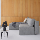 The Osvald Sofa Bed from Innovation Living with twist granite 565 upholstery in a den.